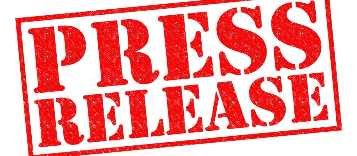 PRESS RELEASE red Rubber Stamp over a white background.